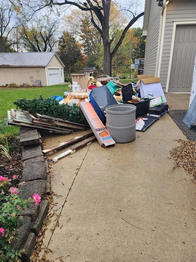 Dumpster being loaded with debris for Residential Dumpster Rental in Cashmere